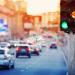 Cars moving on the road in city in late evening