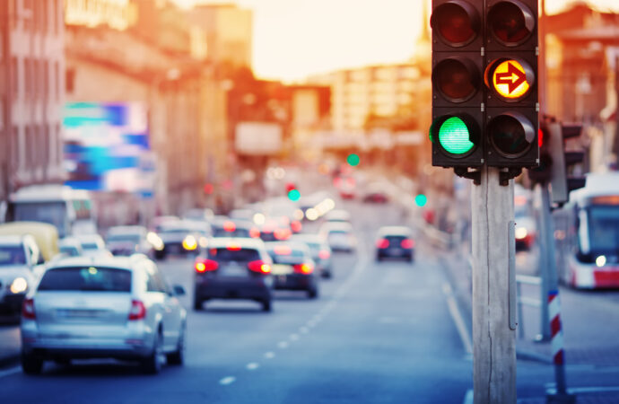 Cars moving on the road in city in late evening